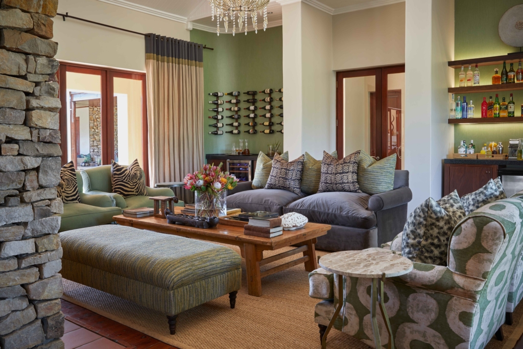 A beautifully decorated living room featuring a combination of comfortable seating, decorative pillows, and a stylish coffee table.